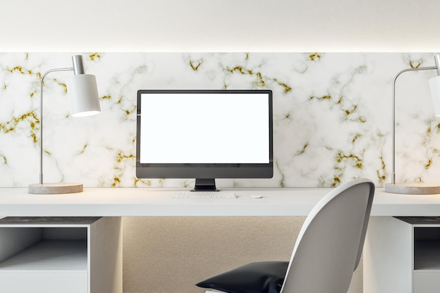 Interior of stylish office with computer on table with blank white screen