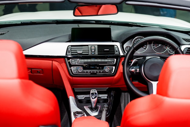 Interior view of car. Modern technology car dashboard, radio and aircondition control button.