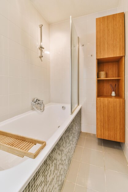 Interior of white tiled bathroom