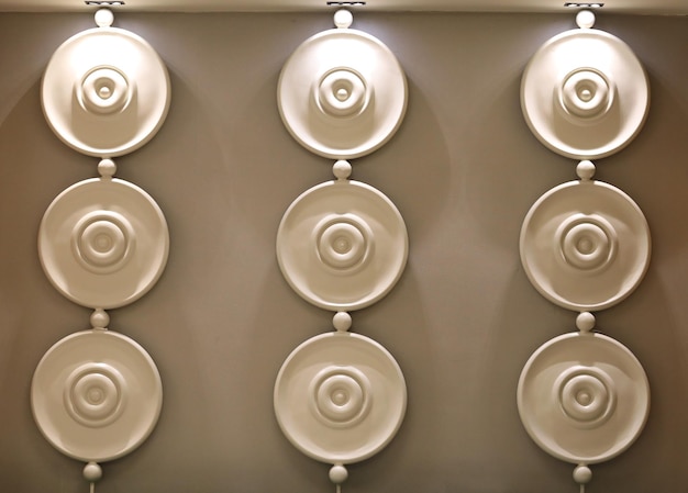 Photo interior with brown mosaic decoration with circles on the wall