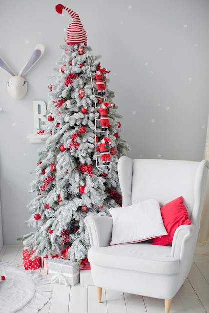 Interior with Christmas tree and armchair