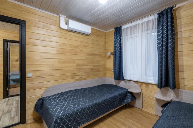 Interior of wooden eco bedroom in studio apartments hostel or homestead