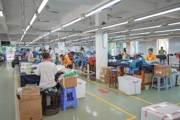 Interior of a workshop for sewing clothes and textiles portrait of professional Seamstress