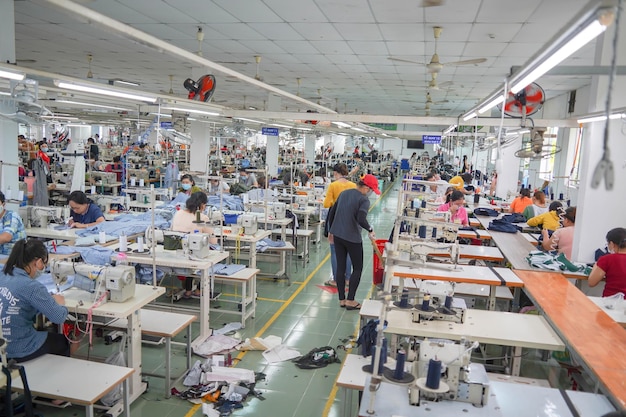 Interior of a workshop for sewing clothes and textiles portrait of professional Seamstress