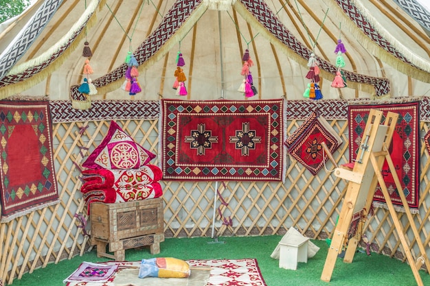 The interior of the yurt Asian national pillows and carpets