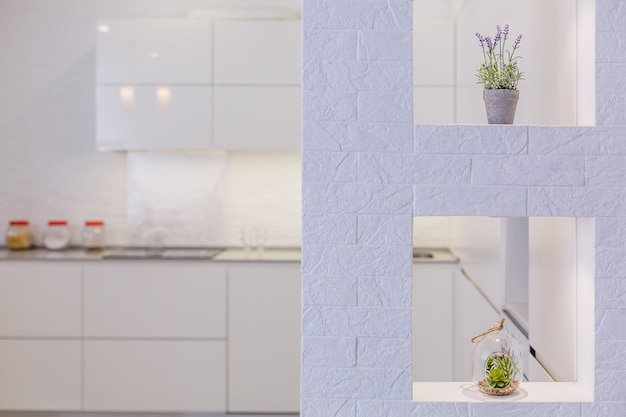 internal shot of a modern kitchen in foreground the water tap and kitchen sink