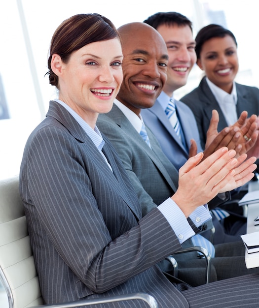 International business team clapping a good presentation