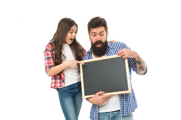 International childrens day Small girl with dad on white background Happy childhood Family news Awesome news Advertising or promotion Father and daughter hold chalkboard copy space Fathers day