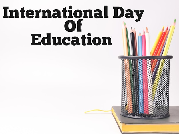 International Day Of Education on white background with colorful pencil and a book