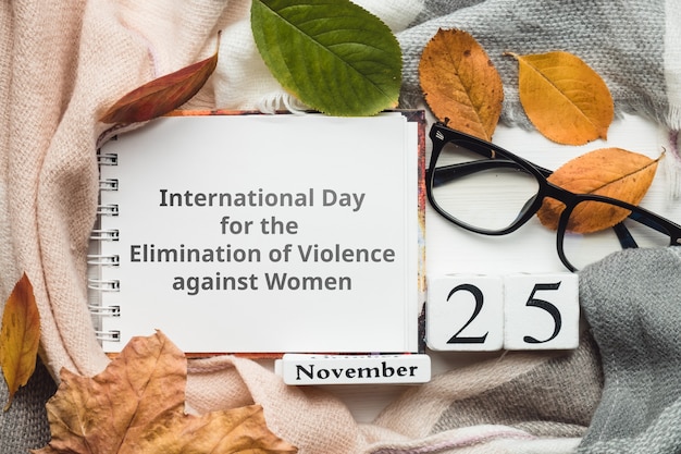 International Day for the Elimination of Violence against Women with autumn leaves