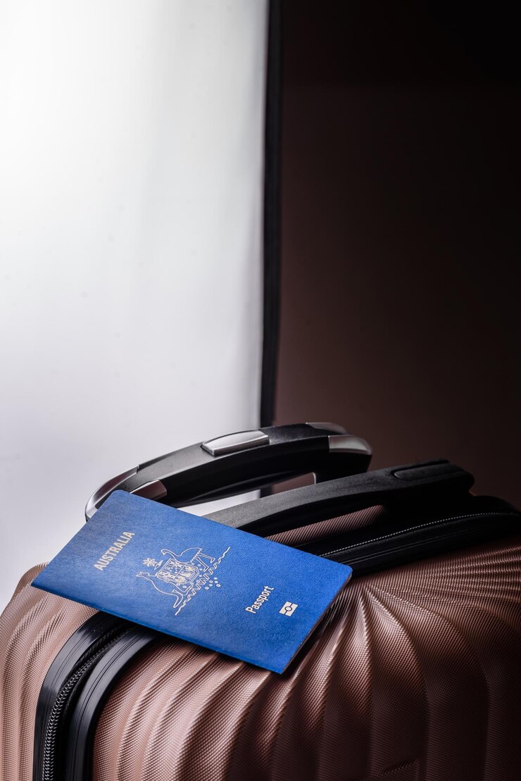 Photo international passport of a citizen of australia on a suitcase