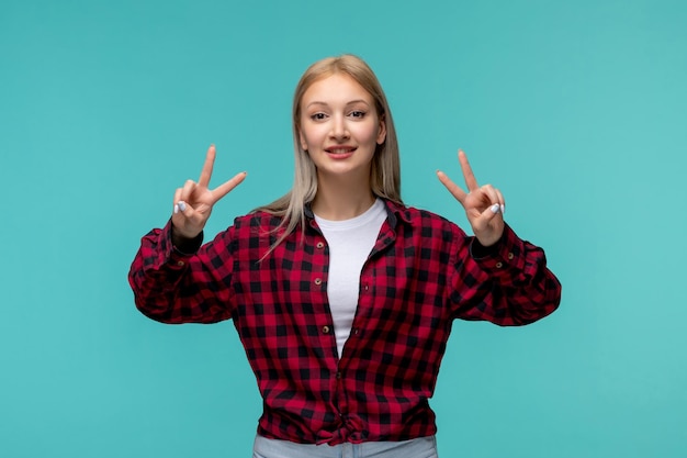 International students day young cute girl in red checked shirt showing two peace signs