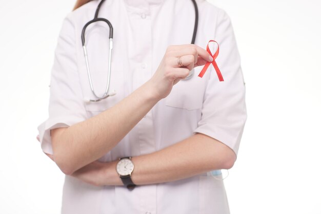 International symbol of the fight against AIDS a doctor holds a symbol of awareness of people with problems