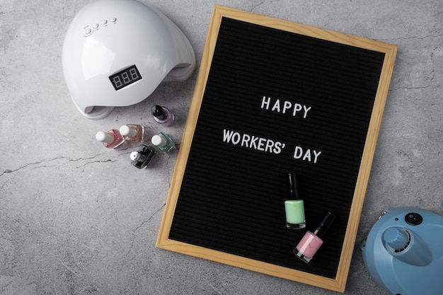 Photo international worker's day with nail technician tools