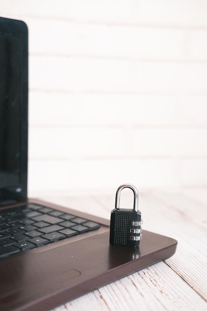 Internet safety concept with padlocked on computer\
keyboard