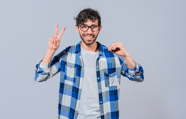 Interpreter man gesturing LOVE AND PEACE in sign language isolated Smiling person gesturing anir and peace in sign language Young man gesturing LOVE AND PEACE in sign language