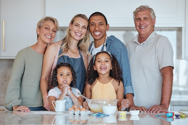 Interracial portrait or big family in a kitchen cooking food or baking cake with eggs flour or milk at home Bakers mother and happy father love bonding with children or grandparents on holiday