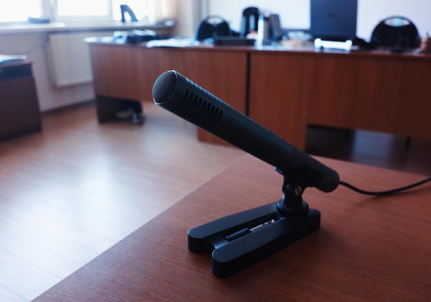 Interview microphone on the wooden table