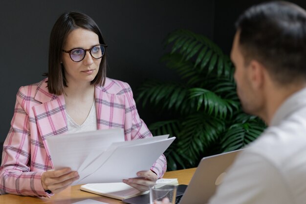 Interview or negotiation successful and beautiful business woman in her office interview