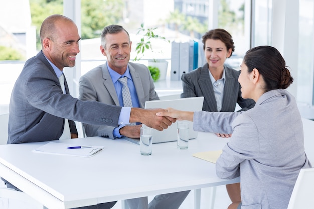 Interview panel listening to applicant