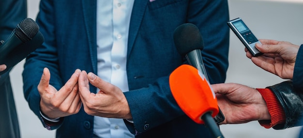 Interviewing businessman on press conference