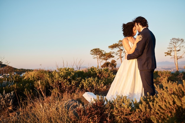 Intimate wedding couple and hug in nature with mock up of marriage celebration in Africa outdoor Commitment save the date and love with bride man and calm embrace with blue sky together in union