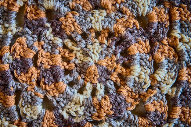 intricate crochet pattern in earth tones texture closeup view