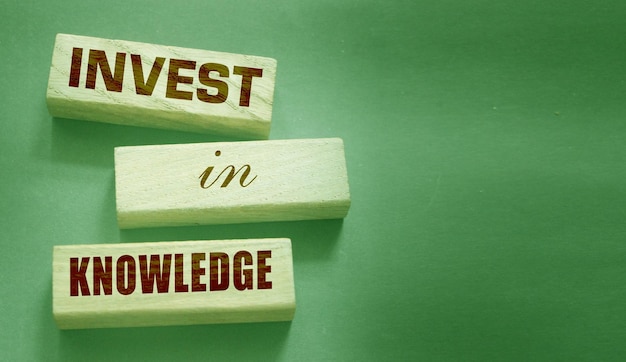 Invest in knowledge words onwooden blocks Inspirational motivational quote Investment in knowledge pays the best dividends education or business training concept