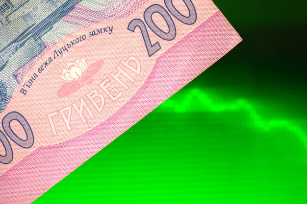 Investment money in ukrainian hryvnia background, growth of ukraine currency photo