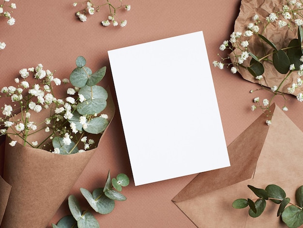 Photo invitation or greeting card mockup with flowers
