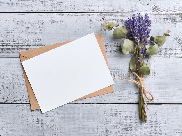 Photo invitation or greeting card mockup with flowers