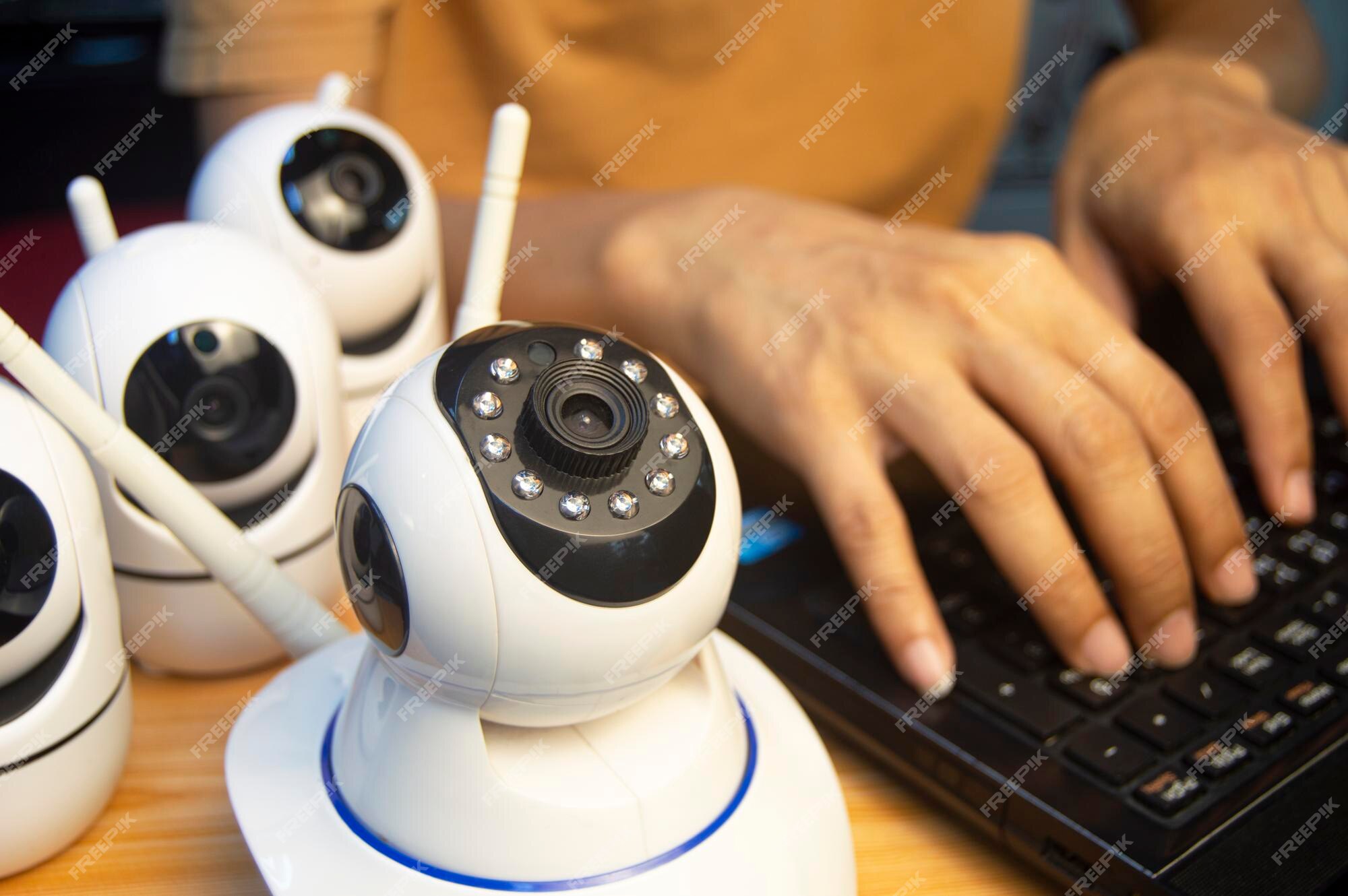 Premium Photo IP camera operator From the computer set up the IP camera