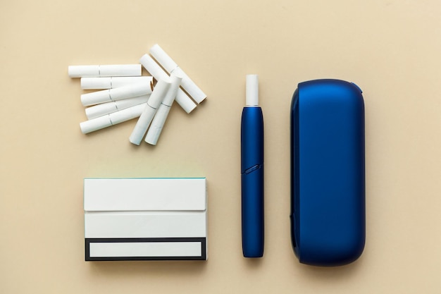 Iqos electronic blue cigarette on a beige background