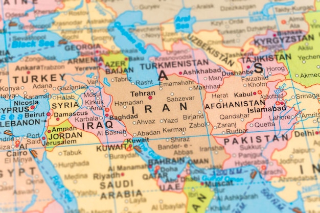Photo iran on the map close up and selective focus photography travel concept image