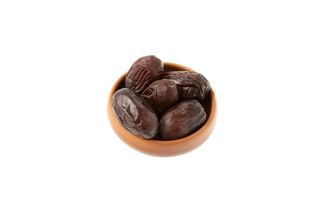 Iranian dates balanced in ceramic bowl on white background Healthy food during religious fasting