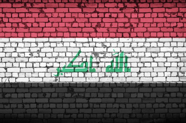 Photo iraq flag is painted onto an old brick wall