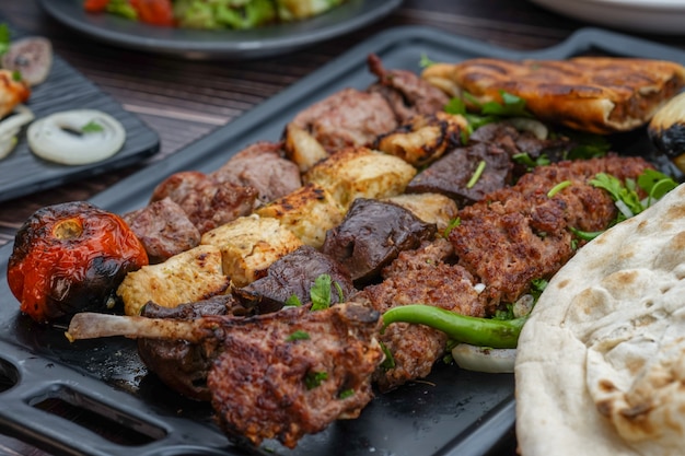 Iraqi mix grills on a black tray