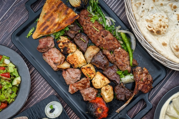 Iraqi mix grills on a black tray