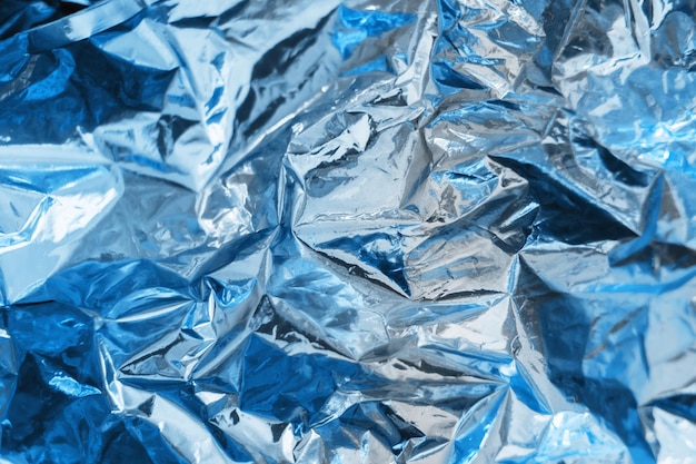무지개 빛깔의 파란색 호일 질감 배경 홀로그램 주름 표면 템플릿 디자인