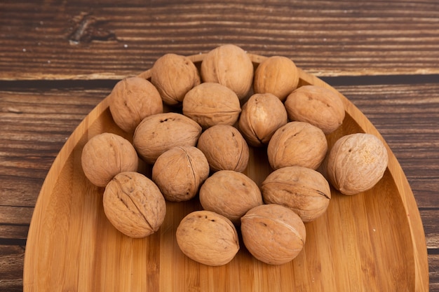 IRipe walnuts in the shell, the theme of healthy eating, vegetarianism, raw food diet.