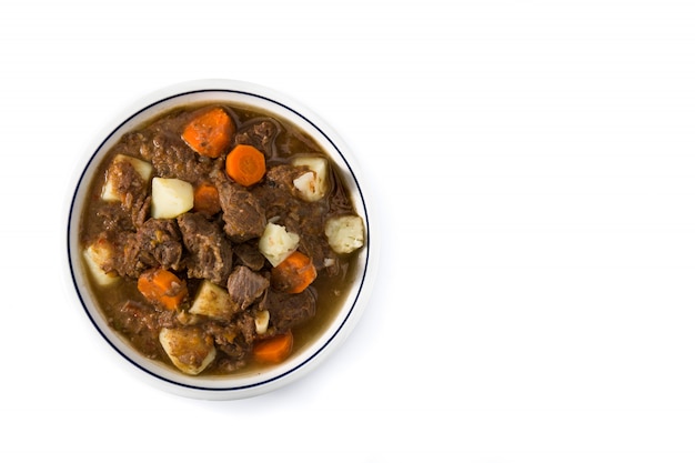 Irish beef stew with carrots and potatoes isolated Top view Copy space