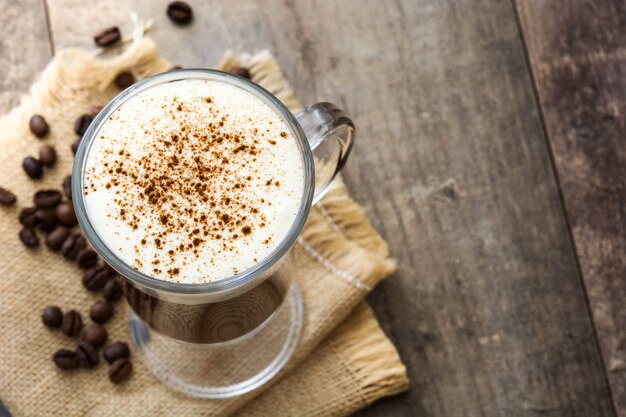 Irish coffee in glass on wooden table