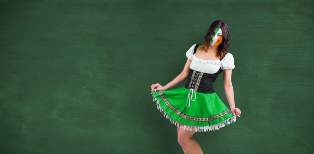 Irish girl smiling against green chalkboard