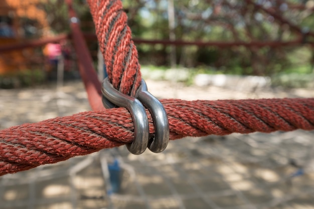 Photo iron rings and red rope.