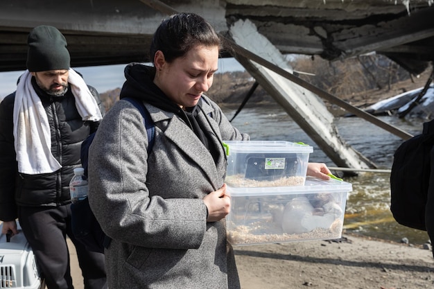 IRPIN UKRAINE Mar 09 2022 War in Ukraine Thousands of residents of Irpin have to abandon their homes and evacuate as russian troops are bombing a peaceful city War refugees in Ukraine