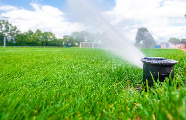 Irrigation with the help of pressure jets with water at the football stadium