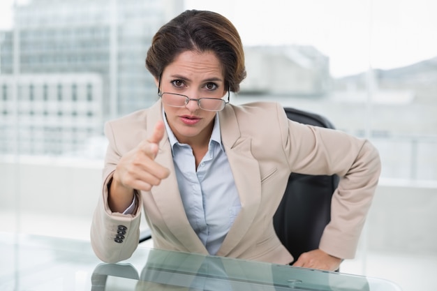 Irritated businesswoman looking at camera