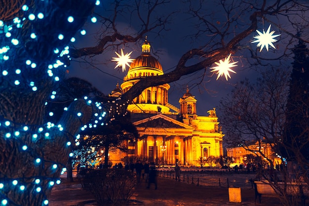 Isaac\'s cathedral on a winter night. christmas decorations,\
night city landscape. st. petersburg, russia - january 6,\
2021.