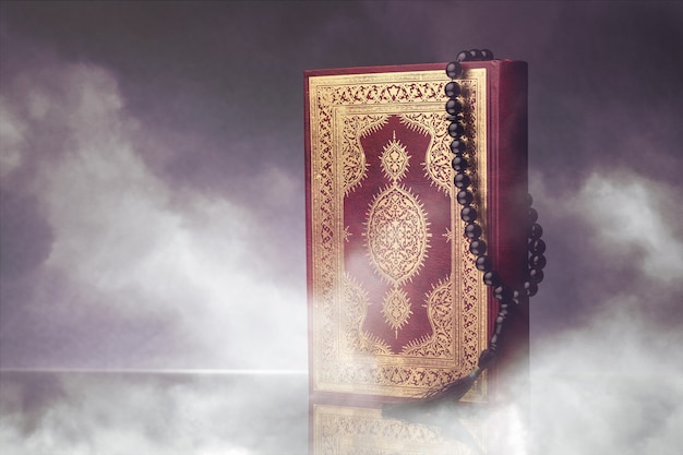 灰色の背景に数珠のイスラム教の本コーラン