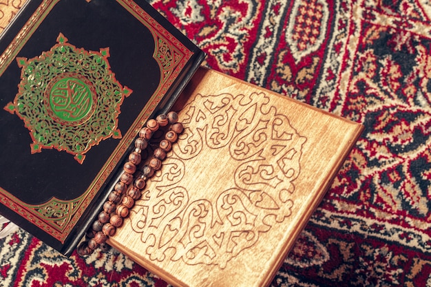 Islamic holy book on wooden table